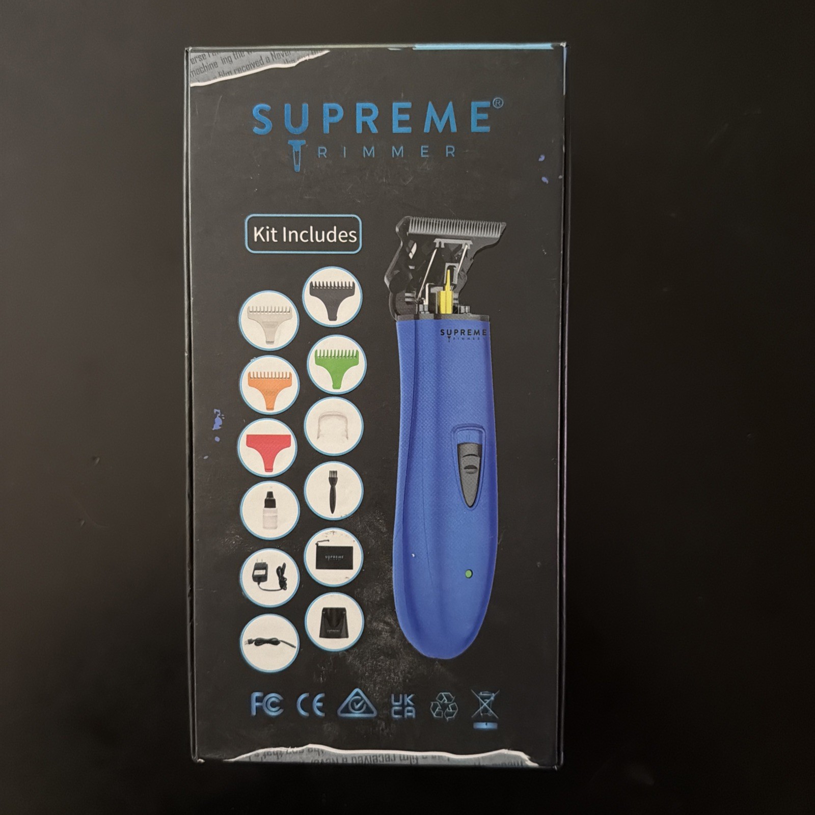 Supreme Trimmer T-Shaper cordless hair trimmer in blue, featuring a DLC blade
