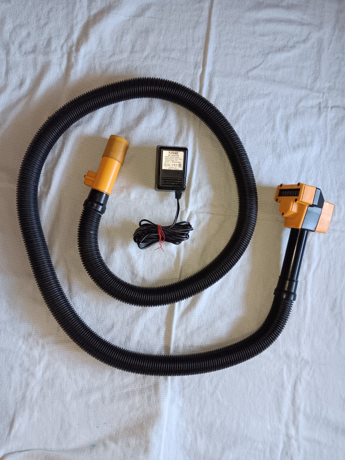 Flowbee Haircutting System tested in box with attachments