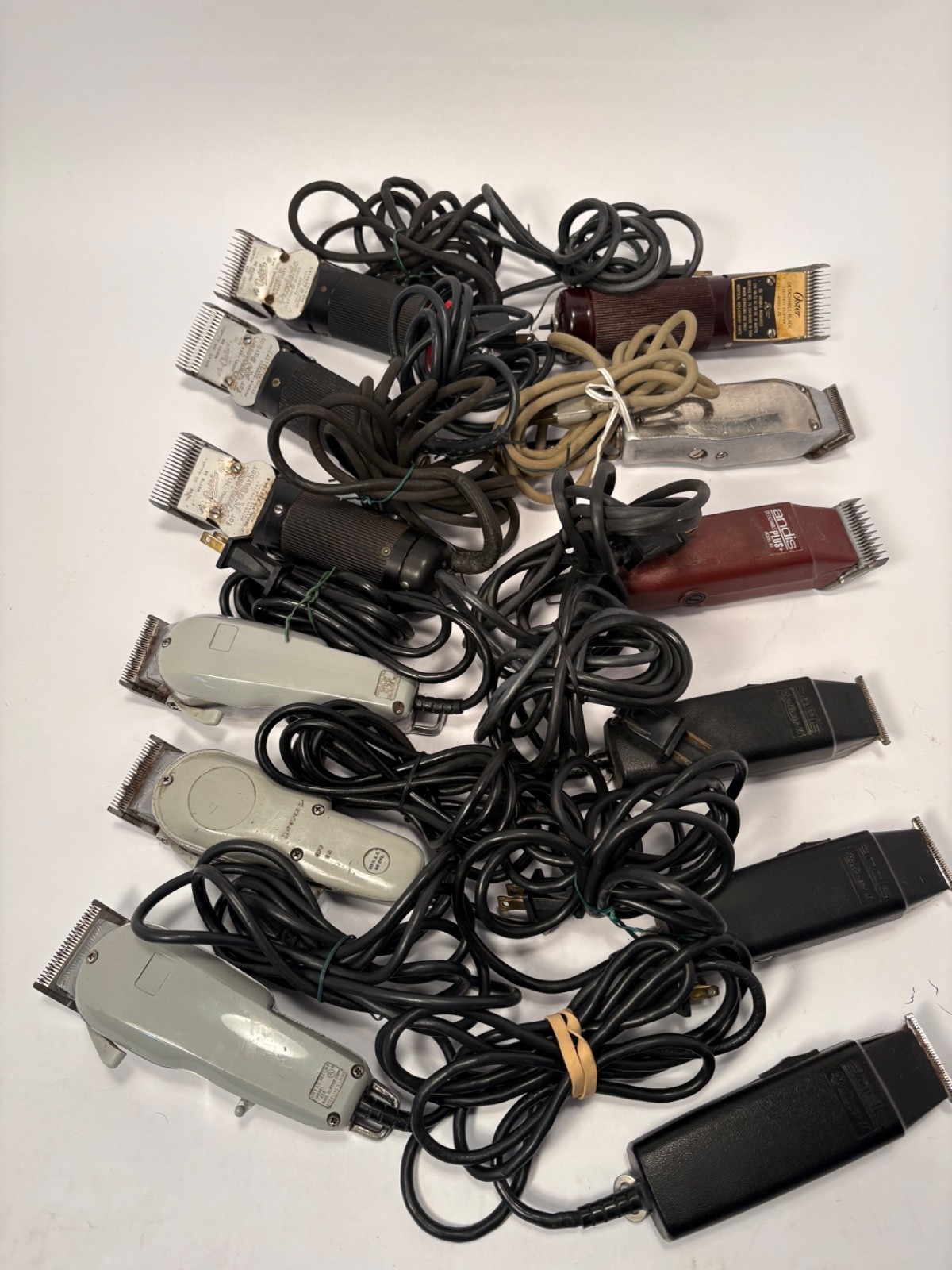 (12) Wahl, Andis, Oster Hair Cutting Clippers and (42) Blades Lot