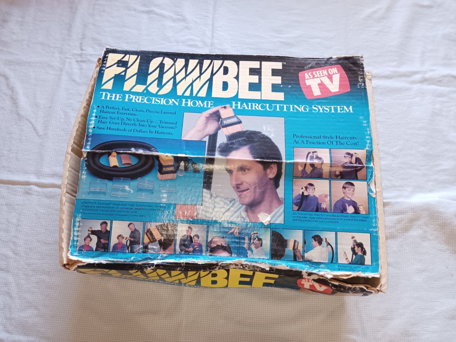 Flowbee Haircutting System tested in box with attachments